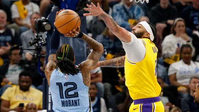 Lakers big Anthony Davis contests a Grizzlies PG Ja Morant jump shot during Game 5 of the 2023 NBA playoffs at FedExForum in Memphis.