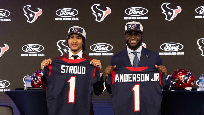 Texans QB CJ Stroud and pass rusher Will Anderson Jr pose for a photo at a press conference at NRG Stadium in Houston.