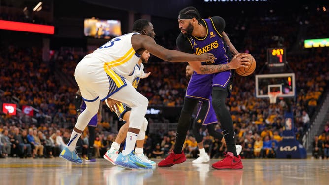 LA Lakers big Anthony Davis sizes up Golden State Warriors PF Draymond Green during Game 2 of the 2023 NBA playoffs.