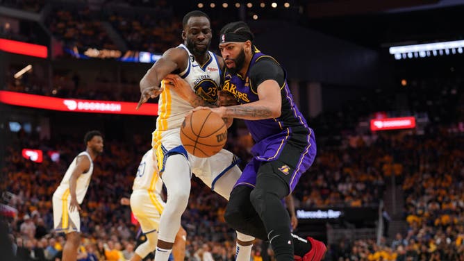 Lakers big Anthony Davis battles Warriors PF Draymond Green in Game 2 of their series at the Chase Center in San Francisco.