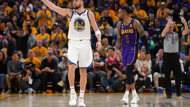 Golden State Warriors SG Klay Thompson points toward a teammate during Game 2 vs. the LA Lakers in the 2023 NBA playoffs at the Chase Center in San Francisco.