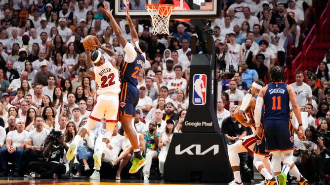 Heat SF Jimmy Butler shoots over Knicks C Mitchell Robinson during Game 3 of the 2023 NBA playoffs.