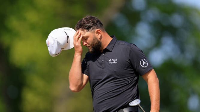 Jon Rahm reacts after a putt on the 9th green during the 1st round of the 2023 PGA Championship at Oak Hill Country Club in Rochester, New York.