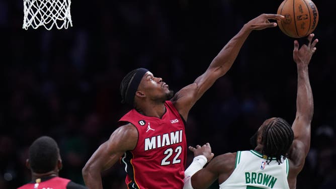 Miami Heat F Jimmy Butler blocks Boston Celtics wing Jaylen Brown at TD Garden.