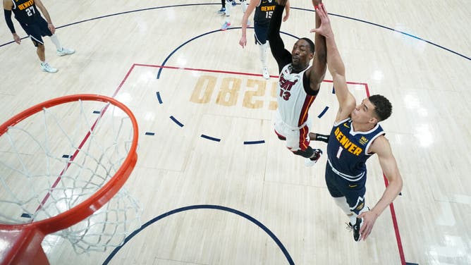 Miami Heat C Bam Adebayo dunks the ball on Denver Nuggets F Michael Porter Jr. in Game 2 of the 2023 NBA Finals at Ball Arena.