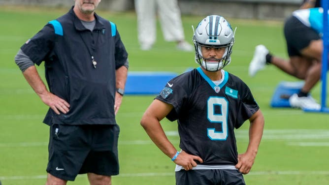 Head coach Frank Reich watches QB Bryce Young during the Carolina Panthers minicamp.