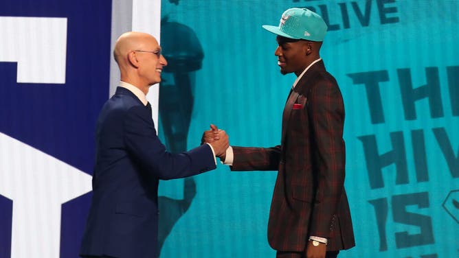 Brandon Miller (Alabama) is greeted by NBA commissioner Adam Silver after being selected 2nd overall by the Charlotte Hornets in the 2023 NBA Draft at Barclays Arena in Brooklyn.