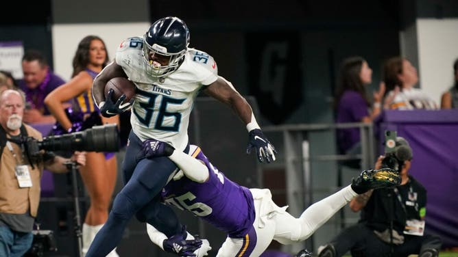 Tennessee Titans RB Julius Chestnut is tackled by Vikings safety Theo Jackson at U.S. Bank Stadium.
