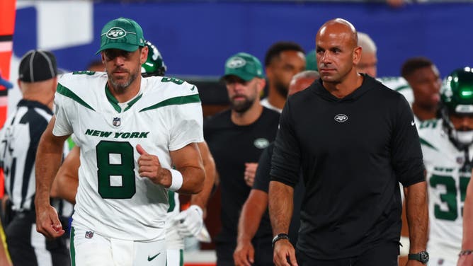 New York Jets QB Aaron Rodgers and head coach Robert Saleh leave the field in their game vs. the New York Giants at MetLife Stadium.