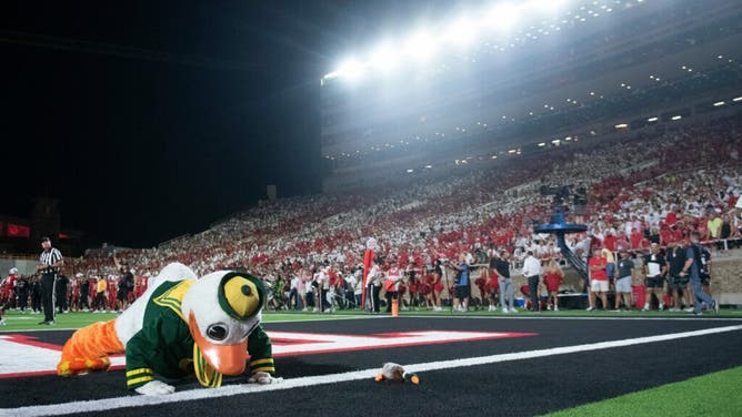 The Oregon Duck does push-ups after Oregon scores against the Texas Tech Red Raiders at Jones AT&T Stadium in Lubbock, Texas.
