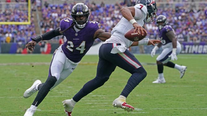 Baltimore Ravens pass rusher Jadeveon Clowney pressures Houston Texans QB C.J. Stroud at M&T Bank Stadium.