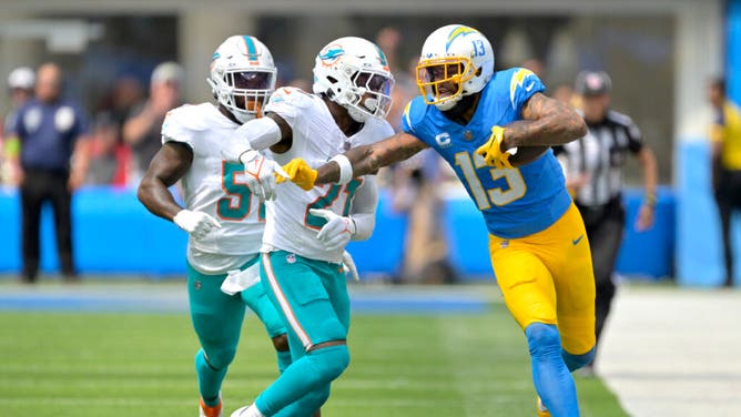 Chargers WR Keenan Allen is forced out of bounds by Miami Dolphins CB Keion Crossen at SoFi Stadium in Los Angeles.