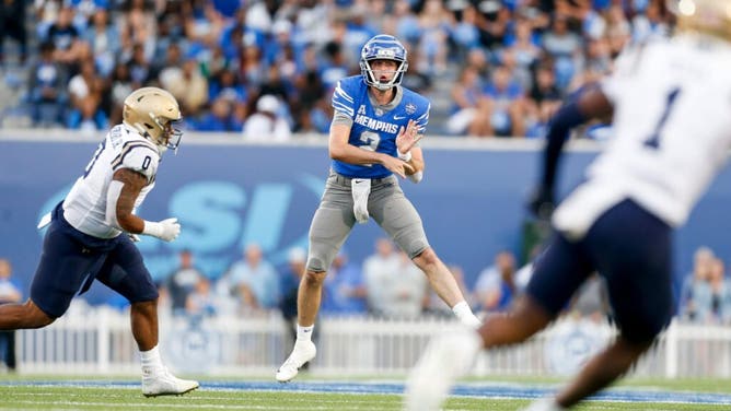 Memphis Tigers QB Seth Henigan throws a pass vs. the Navy Midshipmen at Simmons Bank Liberty Stadium in Tennessee.