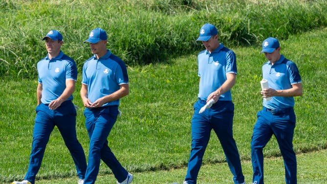 Team Europe golfers Rory McIlroy, Nicolai Hojgaard, Justin Rose, and Matt Fitzpatrick walk the 15th hole during a practice day for the Ryder Cup at Marco Simone.