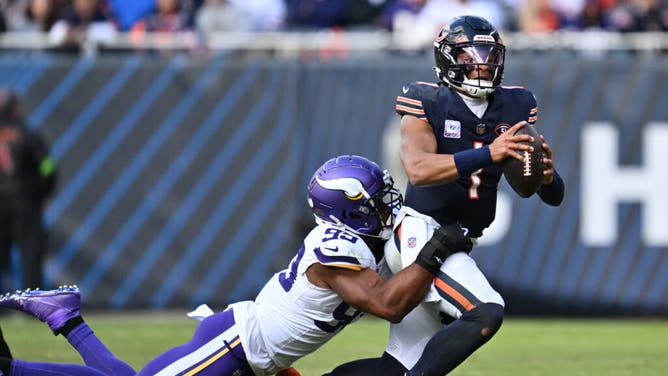 Bears QB Justin Fields is sacked by Minnesota Vikings pass rusher Danielle Hunter at Soldier Field in Chicago.