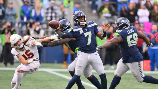 Seahawks QB Geno Smith passes the ball vs. the Arizona Cardinals during the game at Lumen Field in Seattle, Washington.