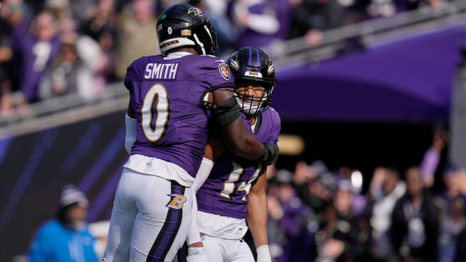 Ravens safety Kyle Hamilton celebrates a pick-six with LB Roquan Smith vs. the Cleveland Browns at M&T Bank Stadium in Baltimore, Maryland.