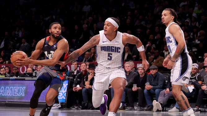 Brooklyn Nets wing Mikal Bridges drives to the basket vs. Orlando Magic PF Paolo Banchero at Barclays Center in Brooklyn.