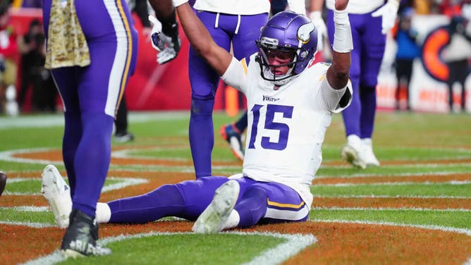 Minnesota Vikings QB Joshua Dobbs reacts after rushing for a TD vs. the Broncos at Empower Field at Mile High in Denver, Colorado.