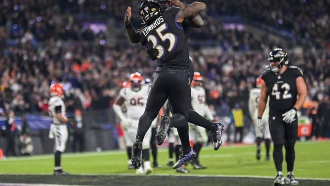 Ravens RB Gus Edwards celebrates with QB Lamar Jackson after rushing for a TD vs. the Cincinnati Bengals at M&T Bank Stadium in Baltimore, Maryland.