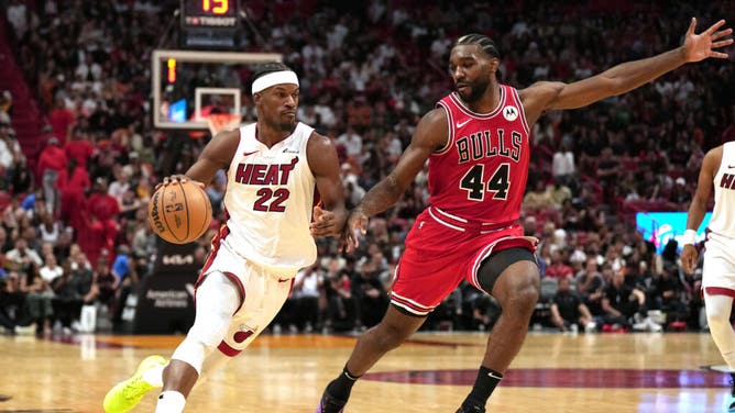 Heat wing Jimmy Butler drives to the hoop on Chicago Bulls forward Patrick Williams at Kaseya Center in Miami.
