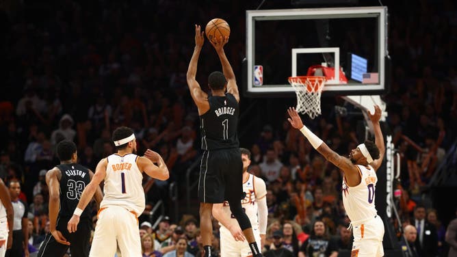 Brooklyn Nets SF Mikal Bridges fires a three vs. Phoenix Suns at Footprint Center in Arizona.