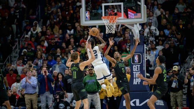 Memphis Grizzlies All-Star Ja Morant shoots the game-winning layup vs. the Pelicans at the Smoothie King Center in New Orleans, Louisiana.