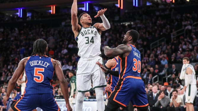 Milwaukee Bucks' Giannis Antetokounmpo shoots a baby hook over New York Knicks PF Julius Randle at Madison Square Garden.