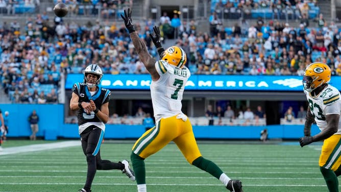 Panthers QB Bryce Young throws past Green Bay Packers LB Quay Walker at Bank of America Stadium in Charlotte, North Carolina.