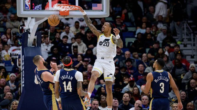 Utah Jazz big John Collins jams it on the Pelicans in an NBA game at the Smoothie King Center in New Orleans, Louisiana.