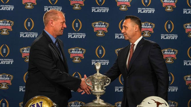 Washington Huskies coach Kalen DeBoer greets Texas Longhorns coach Steve Sarkisian at a 2024 College Football Playoff press conference in New Orleans.