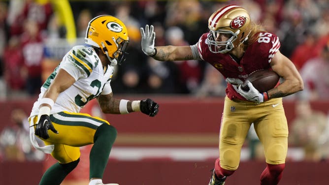 San Francisco 49ers TE George Kittle delivers a stiff-arm to Green Bay Packers safety Jonathan Owens in the 2024 NFC divisional round at Levi's Stadium in Santa Clara, California.