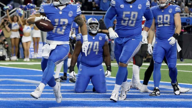 Lions RB Craig Reynolds gets a 1-yard TD vs. the Tampa Bay Buccaneers in the 2024 NFC divisional round playoff game at Ford Field in Detroit.