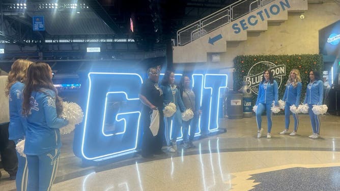Fans pose for a photo at the Detroit Lions watch party at Ford Field prior to the NFC Championship against the San Francisco 49ers.