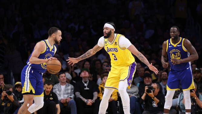 Lakers big Anthony Davis defends Warriors' Stephen Curry during Game 4 of the Western Conference Semifinals.