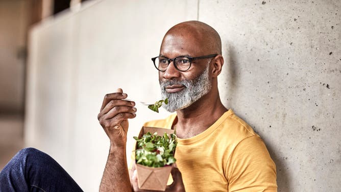 Man Eating a salad