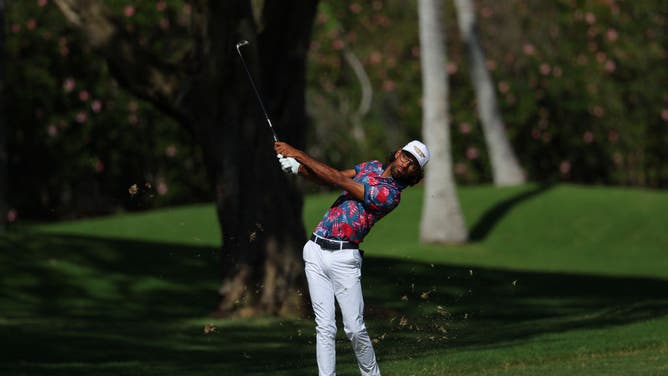Akshay Bhatia hits an approach shot during the final round of the Sony Open at Waialae Country Club in Honolulu, Hawaii.
