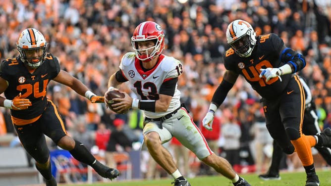 Georgia QB Stetson Bennett runs the ball against the Tennessee Volunteers at Neyland Stadium in Knoxville, Tennessee.