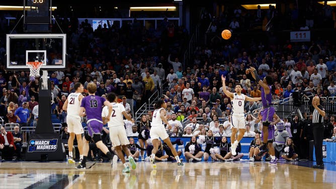 Furman PG JP Pegues shoots the game-winning 3-pointer vs. Virginia in the 1st round of the NCAA Tournament 2023 at Amway Center in Orlando, Florida.