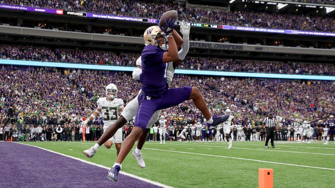 Huskies WR Rome Odunze catches a TD pass vs. the Oregon Ducks in a Pac-12 conference game at Husky Stadium in Seattle, Washington.