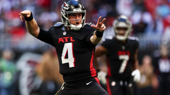 Falcons QB Taylor Heinicke celebrates a big-play during an NFL Week 9 meeting with the Minnesota Vikings at Mercedes-Benz Stadium in Atlanta, Georgia.