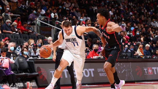 Dallas Mavericks Luka Doncic drives to the basket against the Toronto Raptors F Scottie Barnes at the Scotiabank Arena in Toronto, Ontario, Canada.