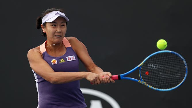 Shuai Peng of China plays a backhand during her Women's Doubles first round match with partner Shuai Zhang of China in the 2020 Australian Open.