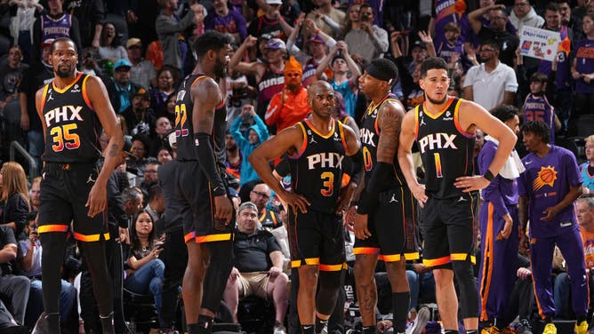 The Suns gather in a game vs. the Nuggets at the Ball Arena in Denver.
