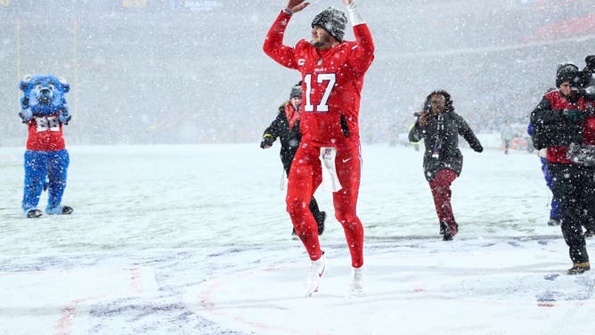 Bills QB Josh Allen celebrates after a win in a snowstorm over the Dolphins in Week 15. The teams meet for the third time this season, this time in the AFC Wild Card round.