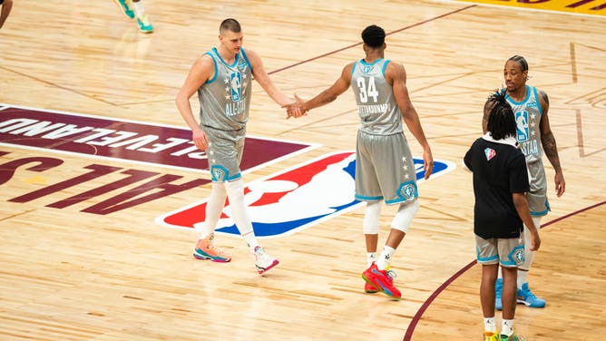 Nikola Jokic and Giannis Antetokounmpo of Team LeBron high-five during the 2022 NBA All-Star Game at Rocket Mortgage Fieldhouse in Cleveland, Ohio.