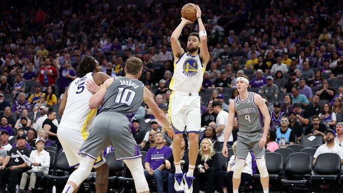Warriors SG Klay Thompson shoots over Kings SG Kevin Huerter in Game 5 of the Western Conference First Round Playoffs at Golden 1 Center.