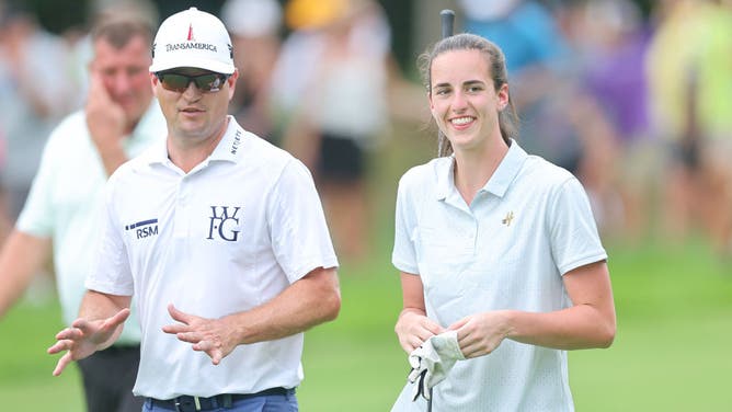 US Ryder Cup captain Zach Johnson talks with Iowa basketball star Caitlin Clark during the pro-am prior to the John Deere Classic at TPC Deere Run on July 05, 2023 in Silvis, Illinois.
