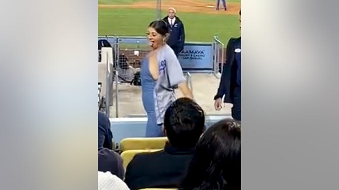 A Dodgers fan dances at a June 4, 2022 game against the Mets.