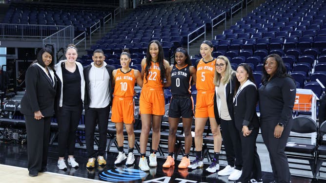 Kelsey Plum, A'Ja Wilson, Jackie Young, Dearica Hamby and head coach Becky Hammon of the Las Vegas Aces pose for a photograph before the 2022 AT&T WNBA All-Star Game.